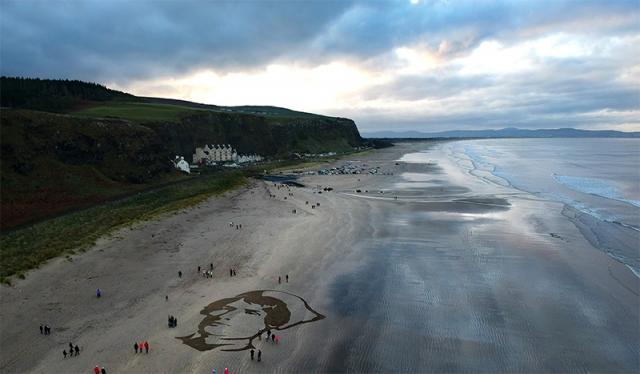 Downhill beach Pages of the Sea - <p>Commissioned by 14-18 NOW, in partnership with the National Trust, Activate Performing Arts, Creative Foundation, Eden Project, National Theatre Scotland, Nerve Centre, Sunderland Culture and Tailesin. In association with Aberyswyth Arts Centre, Magna Vita, MOSTYN, Swansea University and Swansea Council, SeaChange Arts, Theatre Orchard, The Grand Theatre of Lemmings and Visit Blackpool. Sand portraits designed by Sand in your Eye. Supported by the National Lottery throug